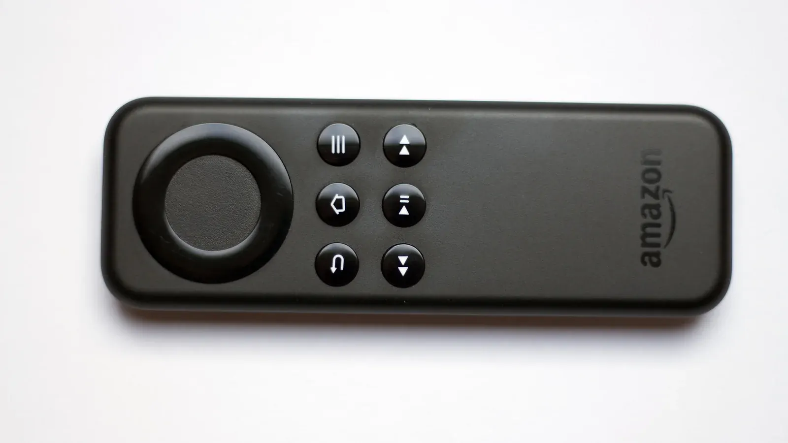 Amazon Fire TV streaming stick remote control on a plain background