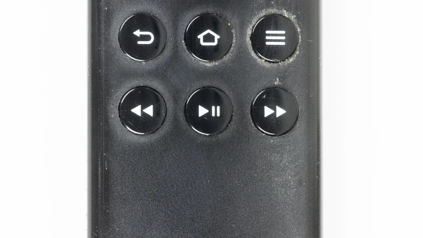 Close-up of a streaming device remote control with navigation buttons