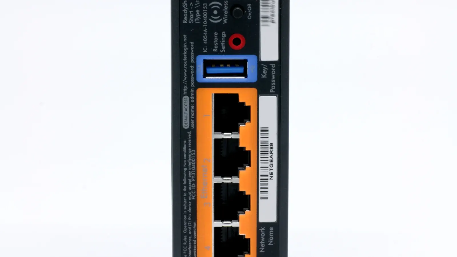 Close-up of the back panel of a Wi-Fi router showing network ports