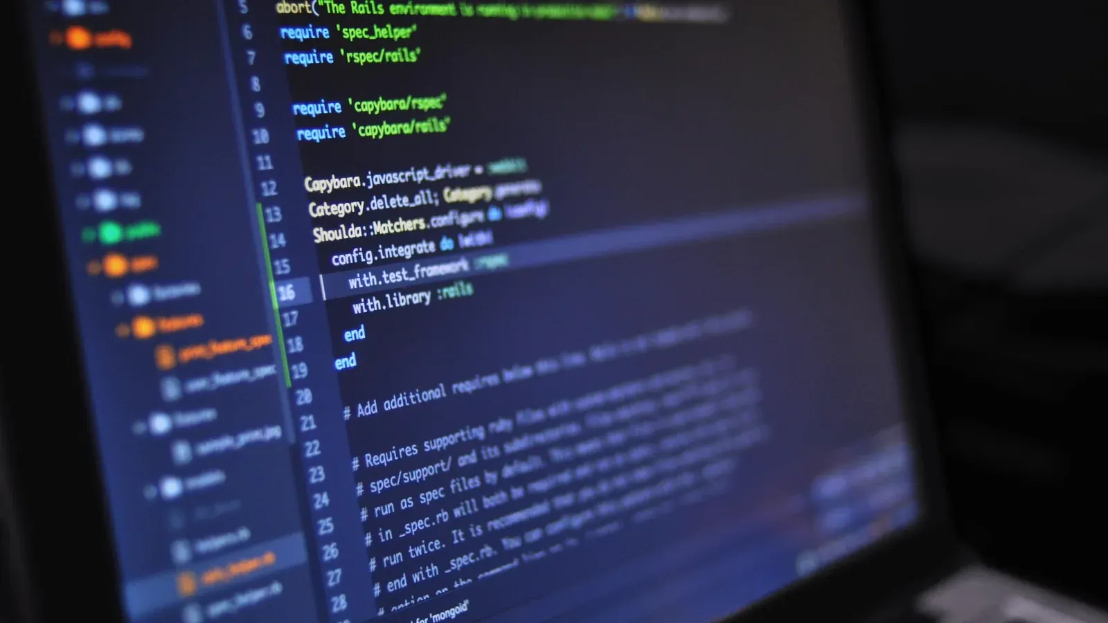 Close-up of programming code displayed on a laptop screen