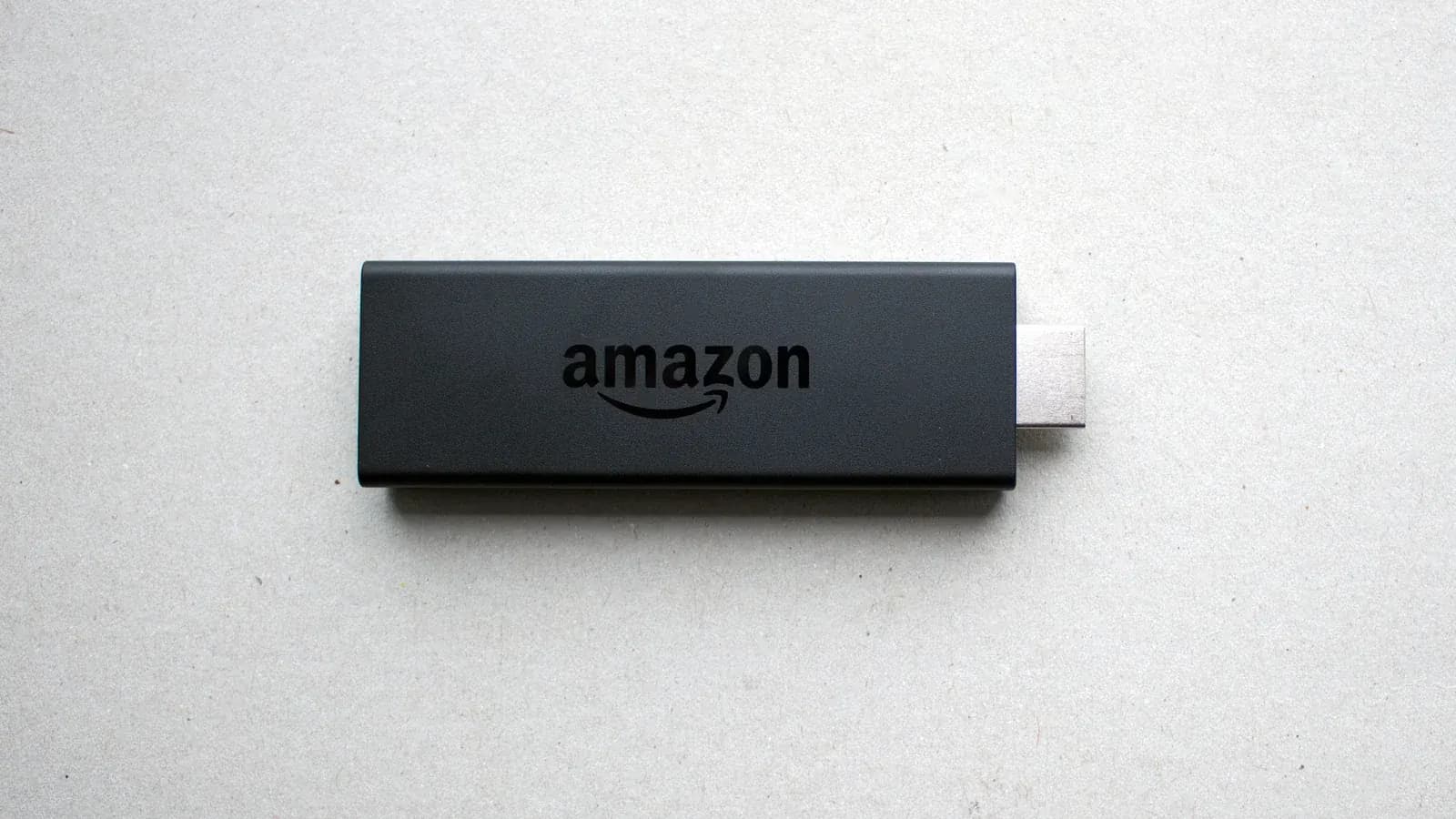 Close-up of an HDMI streaming stick with the connector visible